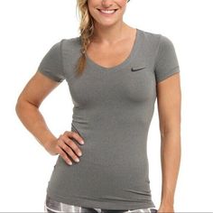 Nike pro fitted woman's v-neck tee Gray Excellent condition Nike Short Sleeve Activewear, Nike Dri-fit Short Sleeve Tops, Fitted Gray Go-dry T-shirt, Fitted Gray T-shirt With Go-dry, Casual V-neck T-shirt For Sports Season, Nike Stretch T-shirt With Go-dry Technology, Nike Gray Stretch Top, Nike Basic Short Sleeve Activewear, Nike Fitted T-shirt For Sports