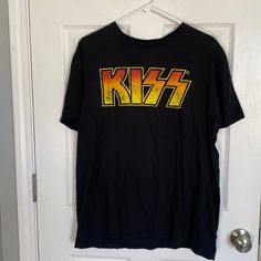 Kiss T-Shirt Size Large Never Worn. Smoke-Free Home. T6 Yellow Graphic Design Tops For Fan Merchandise, Yellow Pop Culture Tops For Streetwear, Yellow Logo Print Top For Fans, Yellow Logo Print Tops For Fan Merchandise, Yellow Short Sleeve Fan Merchandise Top, Yellow Cotton Pop Culture Tops, Kiss Print Shirt, Yellow T-shirt With Logo Print For Fans, Yellow Letter Print T-shirt For Fan Merchandise