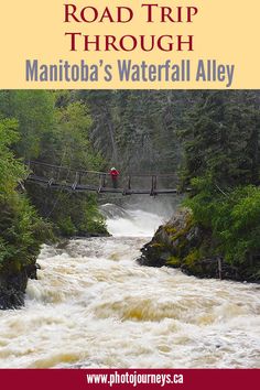 a man walking across a bridge over a river in the middle of a wooded area