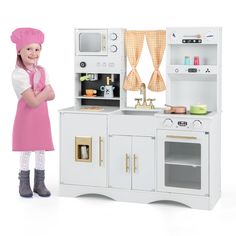 This wooden toy kitchen set fosters cognitive skills, hands-on skills and social interaction. There is a detachable shelf for items of various heights. Having a rich storage space is conducive to developing good sorting habits. In addition, reliable sheets are polished into rounded corners to ensure safety. Children are provided with immersive cooking experiences in different areas - microwave, coffee maker, countertop, ice maker, sink, clock, weather slider, stove and oven. Color: White Materia Toddler Play Kitchen, Modern Kitchen Set, Toy Kitchens, Countertop Ice Maker, Kitchen Playset, Toddler Kitchen, Kitchen Sets For Kids, Pretend Kitchen, Toy Kitchen Set