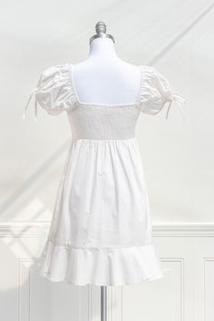 A lovely little summer dress, the Coast of Capri mini dress features a white sateen cotton, a sweetheart neckline with empire waist, side-seam zipper, and short puffed sleeves. Please Note- This item is final sale only. . Details: S: Bust: 32"-36", Empire Waist: 27"-31", Length: 33" M: Bust 34"-38", Empire Waist: 29"-33", Length: 33.5" L: Bust 36"-40", Empire Waist: 31"-35", Length: 34" Length Measured from Shoulder Length Waist to Hem: 21" Unlined Material: 53% Modal, 47% Cotton Gentle Wash Col Cotton Ruched Puff Sleeve Dress For Brunch, Cotton Mini Dress With Ruched Bodice, Summer Daywear Puff Sleeve Dress With Ruched Bodice, Summer Brunch Puff Sleeve Dress With Empire Waist, Summer Puff Sleeve Dress With Empire Waist For Brunch, Summer Puff Sleeve Dress With Empire Waist, Cotton Summer Dresses With Gathered Neckline, Summer Cotton Dresses With Gathered Neckline, Fitted Puff Sleeve Empire Waist Dress For Brunch