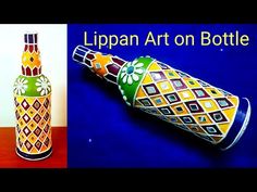 an image of a bottle that is made out of paper and painted with different colors