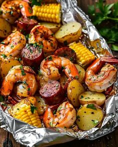 grilled shrimp, potatoes and corn on the cob