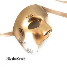 This half-face mask is designed for those who seek to embrace the mystique and grandeur of the stage. Adorned with shimmering gold filigree, it pays homage to the iconic Phantom of the Opera while adding a touch of allure to your ensemble. Be the embodiment of opera's timeless elegance and captivate hearts with your dramatic presence at masquerade balls, themed parties, and other events!


Age Group/Gender - Adult/Men

Size/Type - One size fits all adults

Mask Color - Gold

Mask Material - Poly Half Face Masquerade Mask, Ball Masks, Phantom Mask, Masquerade Ball Masks, Masks Black, Gold Masquerade Mask, Mens Masquerade Mask, Silver Mask, Ball Mask