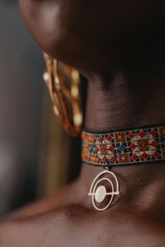 A sienna mosaic choker with a geometric cosmic pendant. Standard length is 16 inches. Choker Jewelry, Adjustable Geometric Metal Jewelry, Bronze Metal Choker Jewelry, Traditional Ceremonial Choker Necklace, Festival Bronze Brass Choker, Bohemian Brass Choker Jewelry, Ceremonial Metal Choker Necklace, Cosmic Jewelry, Indian Accessories