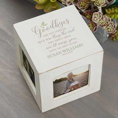 a small white box with a photo inside