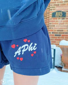 a person wearing shorts with the word aphi on it