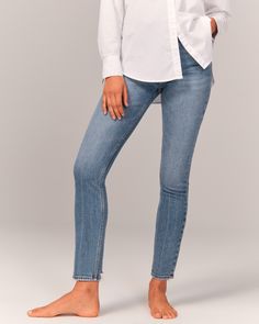 Our high rise skinny jean with figure-defining style and built-in stretch for superior comfort. This jean sits at the waist and looks great with your shirt tucked or untucked. With a form-fitting silhouette from top to bottom, this style is cropped to show a little ankle-and your favorite shoes. Featuring a medium indigo wash, crease detail and frayed hem. Fitted Denim Bottoms For Everyday Wear, Chic Slim Fit Straight Leg Jeans, Denim Blue Fitted High-rise Cropped Jeans, Fitted High-rise Cropped Jeans In Denim Blue, Fitted High Rise Cropped Jeans In Denim Blue, Mid-rise Relaxed Fit Jeans, Mid-rise Relaxed Fit Everyday Jeans, Light Wash Fitted Straight Jeans, Fitted Light Wash Straight Jeans