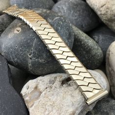 "NOS unused 1940s-1950s old-stock Jaekel His Majesty 1/20 10k yellow gold-filled scissor-expansion watch bracelet. This is a high-quality out of production USA made vintage watchband. The ends are straight and measure 5/8\" (just under 16mm). Spring bars are included. The length measured at the spring bars is 5 3/8\" (137mm), no removable links.  38B.15305.  Visit our store for more unused vintage watch bands, bracelets, straps, buckles, and links." Luxury Gold Men's Tennis Bracelet, Luxury Men's Rectangular Watch Bands, Luxury Timeless Watch Band With Solid Link Construction, Luxury Brass Jubilee Bracelet Jewelry, Luxury Gold Leather Bracelet For Men, Luxury Gold Stainless Steel Watch Bands, Luxury Classic Watch Band With Polished Finish, Luxury Brass Jubilee Bracelet, Luxury Gold Anniversary Bracelet For Men