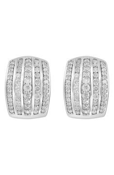 Rows of round-cut diamonds add dazzling shine to huggie-hoop earrings secured in a sterling silver setting. 0.59" hoop diameter; 0.43" width Hinge with snap-post closure Total diamond weight: 1.94ct. Color: I–J Clarity: I3 Sterling silver/diamond Made in the USA Diamond Guide Classic Silver Channel Set Huggie Earrings, Classic Silver Huggie Earrings Channel Set, Classic Silver Huggie Earrings With Diamond Accents, Classic White Huggie Earrings With Diamond Accents, Classic Pave Setting Huggie Earrings For Anniversary, Classic Diamond White Huggie Earrings With Pave Setting, Dazzling Diamond Accented Huggie Earrings For Anniversary, Dazzling Huggie Earrings With Diamond Accents For Anniversary, Silver Diamond Channel Set Huggie Earrings