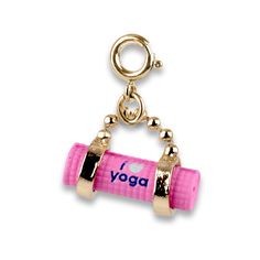 a pink yoga roller charm on a gold plated keychain with the word yoga printed on it