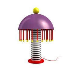 a purple and black lamp with yellow balls on it's top sitting on a red base