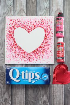 valentine's day crafting supplies including candy, glue and paper hearts