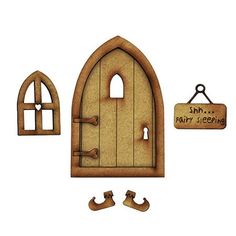 an image of a fairy door with shoes on the floor