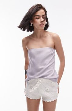 Whether you're headed for a night out or meeting friends for brunch, you'll love rocking this sleek strapless top made from slinky satin and cut in a longline silhouette. Strapless 100% viscose Machine wash, line dry Imported Summer Evening Tops With Straight Neckline, Glamorous Summer Tube Top With Spaghetti Straps, Glamorous Tube Top With Spaghetti Straps For Summer, Summer Tops For Night Out With Straight Neckline, Summer Tops With Straight Neckline For Night Out, Chic Evening Bandeau Tube Top, Summer Evening Tube Top With Straight Neckline, Chic Spaghetti Strap Tube Top For Date Night, Chic Strapless Camisole