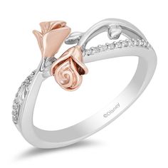 The ring that gets a lot of compliments. Why would anyone not notice this beauty? Crafted from 14k rose gold over sterling silver, here is a ring inspired by Belle and exudes her fierce but kind and gentle but strong character. Featuring a bypass shank with sides lined in diamonds and a centerpiece of meeting roses, the interesting design of this ring is meant to start conversations and leave impressions. Enchanted Jewelry, Enchanted Disney, Enchanted Disney Fine Jewelry, Disney Fine Jewelry, Jewelry Roll, Bridal Jewelry Collection, Rose Fashion, Diamond Fashion Rings, Unique Diamond Rings