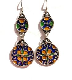 this is a beautiful pair of vintage style silver Berber enamelled earring from Morocco.  It is all handmade by the best Berber silver smith in Morocco.  The silver is over 90% Size: 2.7 inch long and one inch wide Artistic Enamel Drop Earrings, Artistic Design Enamel Drop Earrings, Green Artisan Enamel Earrings, Artisan Green Enamel Earrings, Vintage Multicolor Enamel Jewelry, Green Enamel Earrings With Artistic Design, Pierced Dangle Earrings In Enamel, Bohemian Multicolor Enamel Earrings, Traditional Enamel Jewelry With Matching Earrings