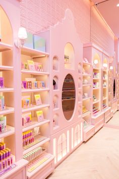 a store filled with lots of pink shelves