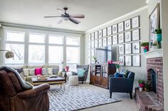 a living room filled with furniture and a fire place