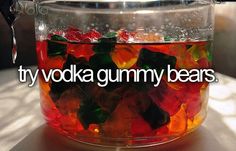 a jar filled with gummy bears sitting on top of a table