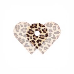 two heart shaped animal print hair clips in white and brown with leopard print on the front