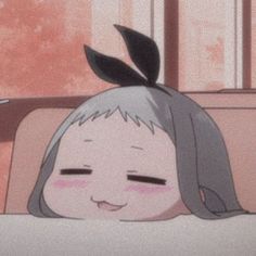 an anime character is laying in bed with her head on the pillow and eyes closed