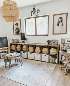 a child's playroom with toys, bookshelves and baskets on the floor