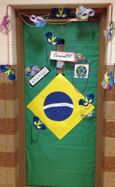 a door decorated in the colors of brazil with decorations on it and paper streamers