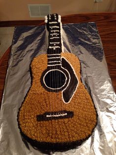 a cake made to look like an acoustic guitar