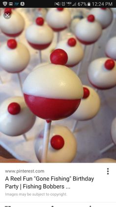 white and red candy lollipops are arranged on top of eachother