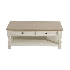 a white coffee table with two drawers