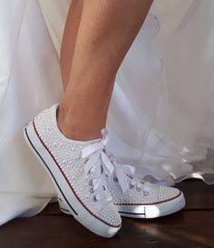 "Wedding Shoes All Star Converse 100% genuine, embellished with all sizes of pearls whith flowers. .Each order includes extra stones and original laces. If you would prefer the all white converse, please feel free to contact us - Upper piece of durable canvas fabric - Classic toe cover made of cast rubber sole - All Star logos on the back of the sole and the inside - They are tied at the highest point of the shoe, flattening the foot inside the shoe Tip: Converse's size is a smaller number than Sneaker Wedding, All White Converse, Star Logos, Sneakers Wedding, Converse Wedding, Bridal Converse, Stars Wedding, Converse Wedding Shoes, Bridal Sneakers