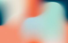 blurry image of an orange, blue and green background with the apple logo on it