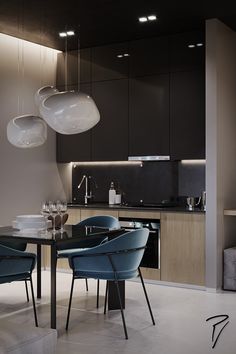 a dining room table with chairs and lights hanging from the ceiling