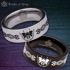 two rings with designs on them sitting next to each other in front of a purple background