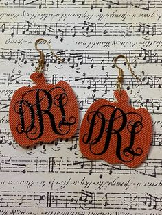 "Perfect for Halloween and Fall. Background is orange with black monogram letters. These earrings are made from faux leather and measure 2.5\" long. Ear wires are gold tone and nickel free." Teacher Earrings, Pumpkin Monogram, Mom Earrings, Halloween And Fall, Princess Earrings, Letter Earrings, Fall Background