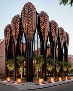 an artisticly designed building in the middle of a street with trees growing out of it