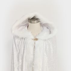 This cloak is the perfect costume accessory for any cosplay, LARP, DC or dress up event. This cloak is made from 2 layers of polyester velour, has a white faux fur trim and the hood is larger than our regular hooded cloaks. Sizing: These cloaks come in three sizes: Small (Kids - 30" long), Medium (Small Adult - 46"), Large (Regular adult - 56"). Care: Hand wash or spot clean as needed, hang dry or flat lay. Fantasy Cape For Costume Party In Winter, Fantasy Winter Cape For Costume Party, Elven Style Costume For Winter Costume Party, Elven Winter Costumes For Costume Party, Winter Elven Costumes For Costume Party, Fantasy Style Winter Costume Cape, Fantasy Winter Costume Cape, Fantasy Cape Costume For Cosplay Events, Cape Costumes For Cosplay And Fantasy Events