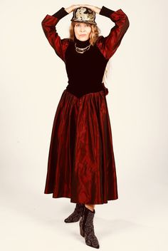 "80s Taffeta Dress, Burgundy Velvet, Big Bow, Long Sleeve Holiday Gown This dress is right out of 1985. It's in excellent condition. Perhaps handmade. Puff taffeta sleeves. Velvet bodice. Full taffeta skirt portion. Zippers up back. Model is wearing black turtleneck.  Model is 5'4\" and a size 4 for scale. Please see exact measurements below.  Item measured while flat, double where applicable, i.e. waist, hips. Shoulder to shoulder 15\" Armpit to armpit 17\" Waist 13.5\" Hips 40\" Sleeve length 24\" Dress length 49\"" Holiday Gown, Burgundy Velvet Dress, Taffeta Skirt, Taffeta Dress, Burgundy Velvet, 80s Dress, Red Coat, Big Bow, Black Turtleneck