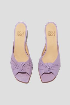 The Greta is a boudoir slipper-inspired mule that captures a playful mix of daytime sensibility & evening refinement. Whether you’re wearing the Greta for daytime play or after-dark doings, you will feel both comfortable and well-turned-out, thanks to a low, triangular heel and a pretty pleated-knot detail at the toe. Style Greta back to loose, casual pants for a breezy date look, or wear them with a cocktail dress to the next wedding on your calendar. Kidskin leather upper, vegetable tanned leather lining, leather outsole. Heel height: 1 ¾ inches (45 mm) Handmade in Argentina Elegant Open Toe Evening Slippers, Chic Summer Kitten Heels With Deep Heel Cup, Chic Summer Slippers With Open Heel, Kitten Heels With Deep Heel Cup For Summer Evenings, Chic Summer Kitten Heels For Cocktail, Summer Cocktail Mules With Padded Heel, Elegant Almond Toe Slippers For Spring, Spring Evening Mules With Almond Toe, Summer Evening Mules With Open Heel