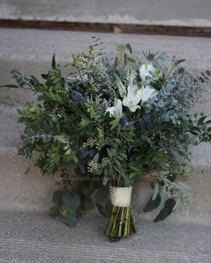 a bouquet of flowers is sitting on the steps