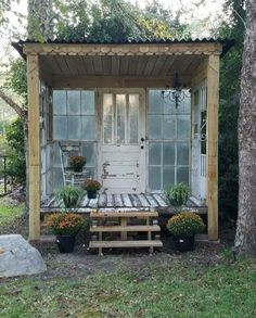 a white door sitting next to a wooden bench