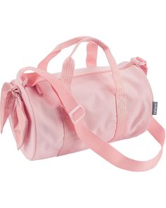 a pink duffel bag with a bow on the front and shoulder strap around it