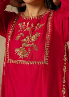 Featuring rani pink chiniya silk kurta set paired with hand embroidered detailed pants. Yoke is highlighted with anar motif using antique gold handwork. Traditional Palazzo Set With Straight Kurta In Raw Silk, Traditional Slub Silk Palazzo Set With Resham Embroidery, Traditional Gold Palazzo Set With Intricate Embroidery, Gold Embroidered Palazzo Set For Diwali, Festival Chanderi Sharara With Gold Embroidery, Festive Sharara With Gold Embroidery In Raw Silk, Anarkali Style Sharara With Gold Embroidery, Bollywood Style Raw Silk Sharara With Gold Embroidery, Traditional Raw Silk Palazzo Set For Festive Occasions