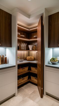 an open pantry with lots of food and drinks on the counter top in front of it