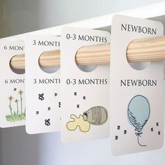 there are three months hanging on the clothes pegs with numbers and pictures attached to them