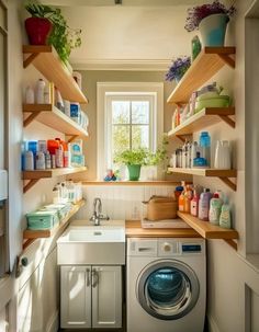 a washer and dryer in a small room with open shelves on the wall