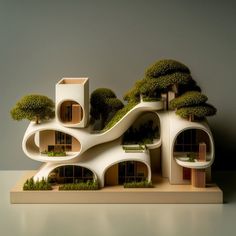 a model of a house with trees on the roof