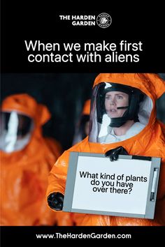 a woman in an orange space suit holding a sign that says when we make first contact with aliens