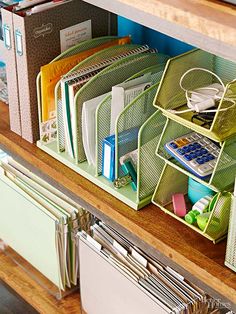 a bunch of folders are stacked on top of each other in a filing cabinet